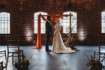 Bride and groom at the top of the aisle