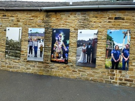 Elsecar Heritage Centre - Front Entrance. A wall with images of weddings, families enjoying a day out and historic Elsecar