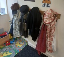 Dressing up costumes hanging on pegs in the Visitor centre
